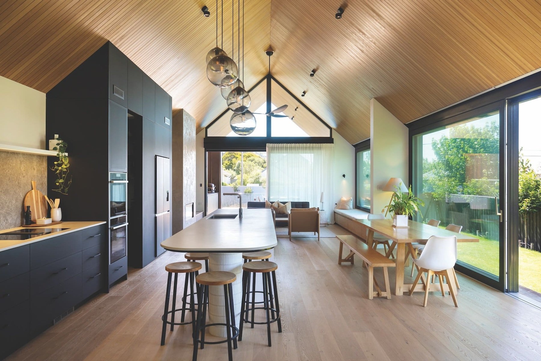 Oiled oak timber floor in an open-plan kitchen and dining space, showing a soft matt finish.